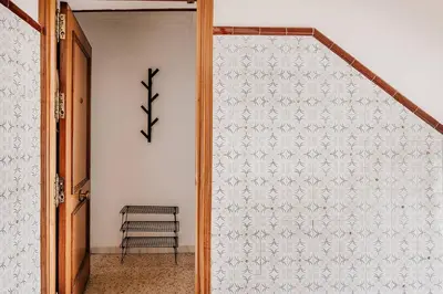 a sliding door in a hallway with a stair case at Apartamento Valdés - Ole Solutions in El Puerto de Santa María