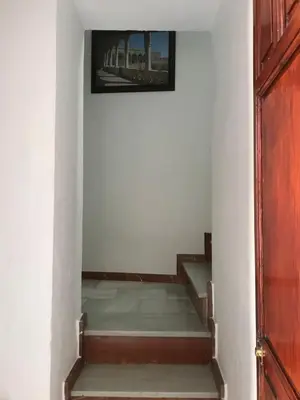 a room with stairs with a picture on the wall at El rincón de Manolita #3 in Bornos