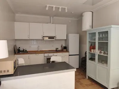 a kitchen with white cabinets and white appliances at Estreno centro y playa Cádiz in Cádiz