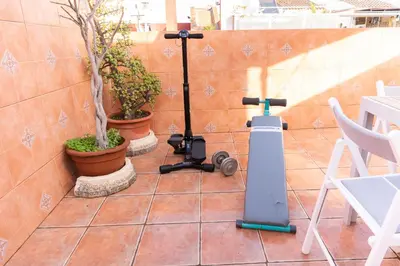 a camera on a patio next to some plants at Casa RECREO in Cádiz