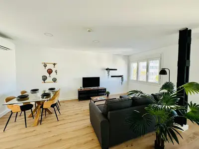a living room with a couch and a table at Apartamentos La Muralla Grupo AC Gestion in Cádiz