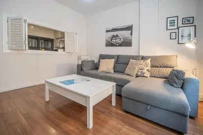 a living room with a couch and a coffee table at Apartamento La Luna Nueva en Cádiz in Cádiz