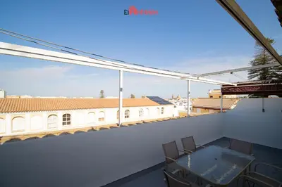 a view from the balcony of a building with a table and chairs at El Anfitrión - Paleobull Castillo in Sanlúcar de Barrameda