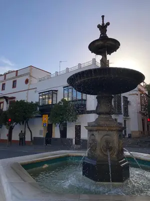 a water fountain in the middle of a street at Apartamentos Makao Puerta del Olivillo in Jerez de la Frontera