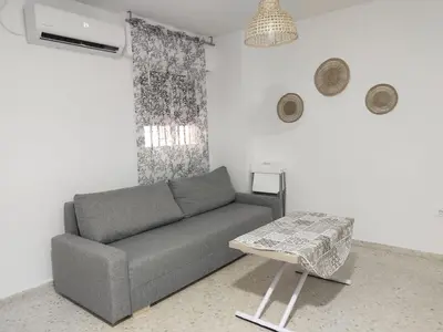 a living room with a couch and a table at Mima in Cádiz
