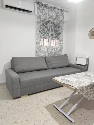 a living room with a couch and a table at Mima in Cádiz