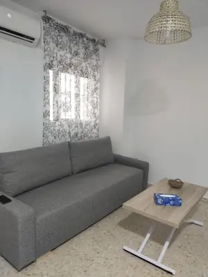 a living room with a couch and a table at Mima in Cádiz