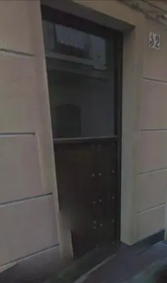 a door to a closet with a window in a building at Mima in Cádiz