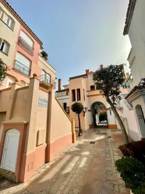 an empty street in a city with buildings at GATU Sherry, junto puerto deportivo y playa in El Puerto de Santa María