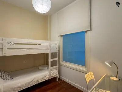 a bedroom with a bed with two towels on it at Palacio Alameda Heart Of Cadiz GRUPO AC Gestion in Cádiz