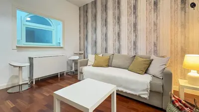 a flat screen tv sitting on top of a white entertainment center at Palacio Alameda Heart Of Cadiz GRUPO AC Gestion in Cádiz