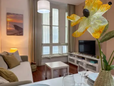 a living room with a couch and a table at Palacio Alameda Heart Of Cadiz GRUPO AC Gestion in Cádiz