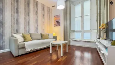a living room with a couch and a table at Palacio Alameda Heart Of Cadiz GRUPO AC Gestion in Cádiz