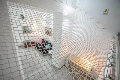 a white tiled wall with magnets on it at Apartamento El Cobijo de Cádiz in Cádiz