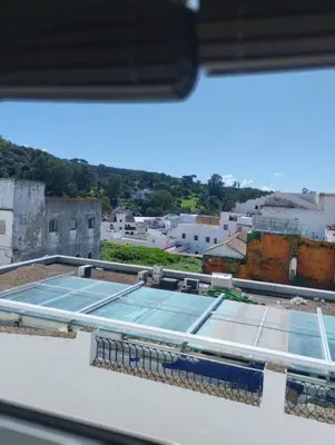 a tennis court on the roof of a building at La casa de loto in Alcalá de los Gazules