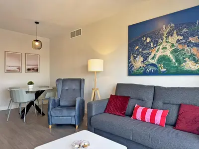 a living room with a couch and a chair at Apartamento Alazán - Ole Solutions in Jerez de la Frontera