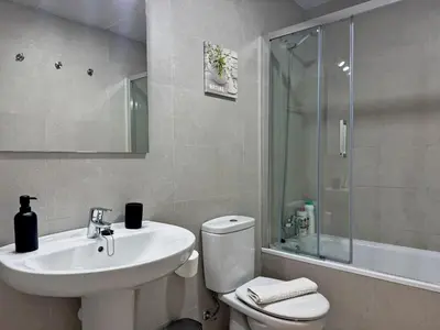 a bathroom with a sink and a toilet and a shower at Apartamento Alazán - Ole Solutions in Jerez de la Frontera