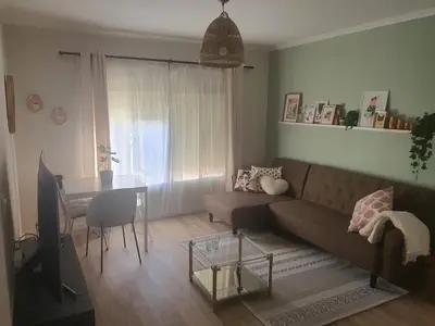 a living room with a couch and a table at Apartamento Juan Belmonte in Jerez de la Frontera