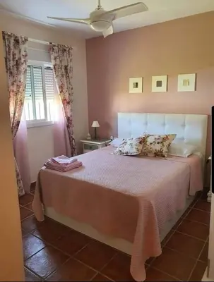 a bedroom with a large bed in a room at Orchard View in Campano