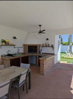 a kitchen with a table and a counter top at Orchard View in Campano
