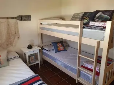 a room with two bunk beds and a bed at Orchard View in Campano
