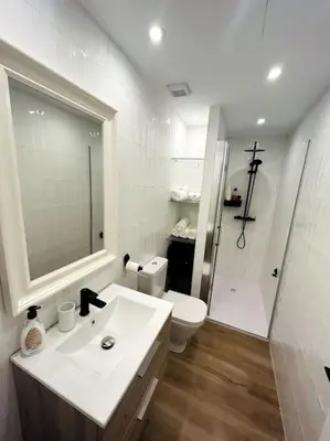a bathroom with a sink and a toilet and a shower at Apartamento Arsenio Beach in Cádiz
