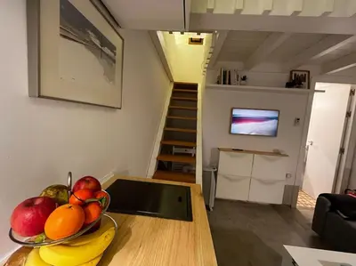 a bowl of fruit on a table in a living room at Casa de invitados, a pie de playa, en La Torre Verde in El Puerto de Santa María