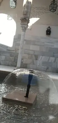 a boat in a pool of water in a fountain at Casa Palacio Arcos del Carmen in Jerez de la Frontera