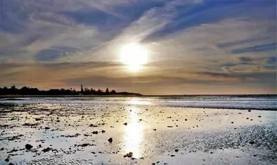 a view of the beach at sunset at Casa Carivid - en el centro y con parking gratis - in Sanlúcar de Barrameda