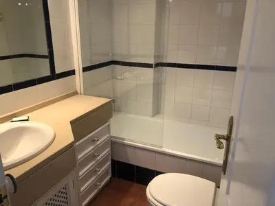 a bathroom with a sink and a toilet and a shower at Villa Bosque Novo Sancti petri Grupo AC Gestión in Chiclana de la Frontera