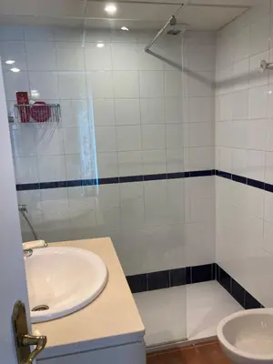 a bathroom with a sink and a shower at Villa Bosque Novo Sancti petri Grupo AC Gestión in Chiclana de la Frontera