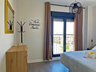 a bedroom with a bed and a window at Apartamento Sheris - Ole Solutions in Jerez de la Frontera