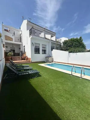 a house with a yard with a swimming pool at VILLA SALMONETE in Sanlúcar de Barrameda