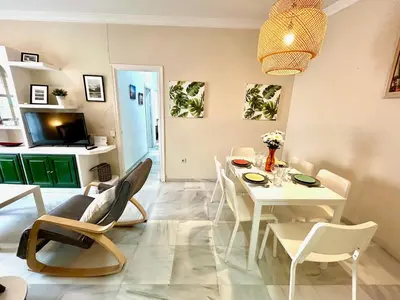 a living room with a white table and chairs at GATU Guateque , 