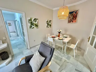 a living room with a table and a chair at GATU Guateque , 