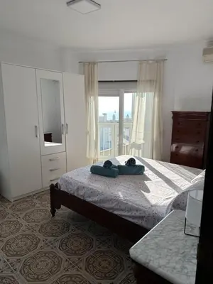 a bedroom with a large bed and a window at Apartamento Vista-Beach in Cádiz