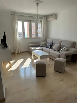 a living room with a couch and a table at Apartamento Vista-Beach in Cádiz