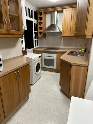a kitchen with a sink and a washer and dryer at Apartamento Vista-Beach in Cádiz
