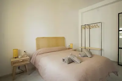 a bedroom with a bed with two pillows on it at Ocean View Ha Apartment in Cádiz