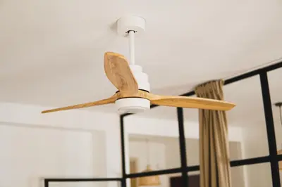 a wooden ceiling fan hanging from a ceiling at Ocean View Ha Apartment in Cádiz