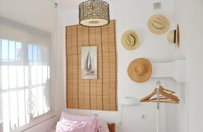 a room with hats hanging on a wall at Casa de los Abuelos in Hozanejos
