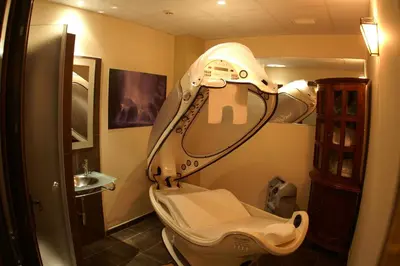 a bathroom with a sink and a toilet with a mirror at Hotel Spa Cádiz Plaza in Cádiz