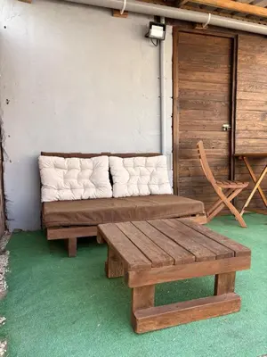a couch sitting in the corner of a room at ADAMA Glamping in Chiclana de la Frontera