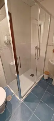 a bathroom with a shower and a toilet at Apartamento Posidonia Free Parking in Cádiz