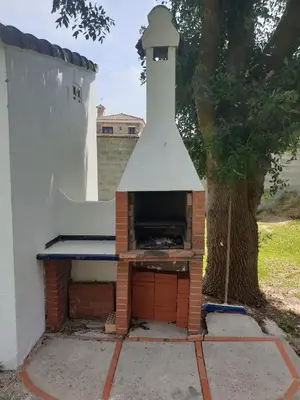 a brick oven with a tower on top of it at Casa Francesca, 90 m2, jardin de 1500m2 in Hozanejos