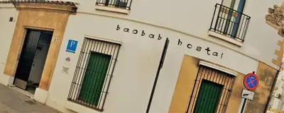 a white building with the words roberto hospital on it at Hostal Baobab in El Puerto de Santa María