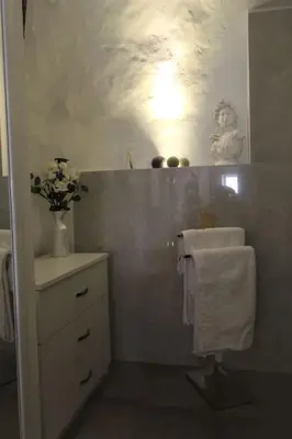a bathroom with a white sink and a white towel at Estudio 