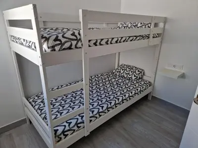 a couple of bunk beds in a room at Apartamento mi currilla in Sanlúcar de Barrameda