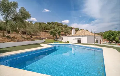 a swimming pool in front of a house at Pet Friendly Home In Algar in Algar