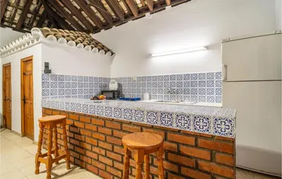 a kitchen with blue and white tiles on the counter at Pet Friendly Home In Algar in Algar